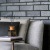 modern brick wall with close-up of decor and a comfy couch